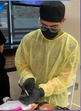 Dr. Diamse providing dental care